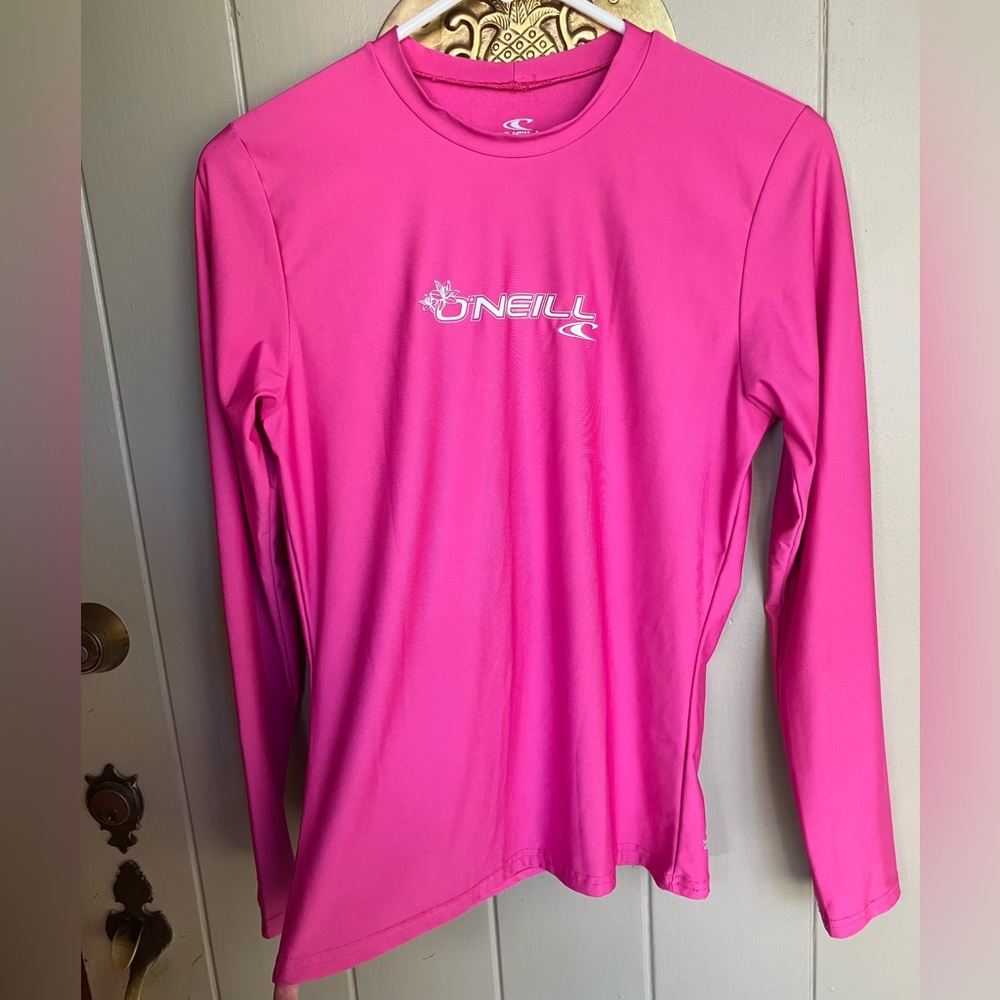 Bright pink O’Neill swim shirt